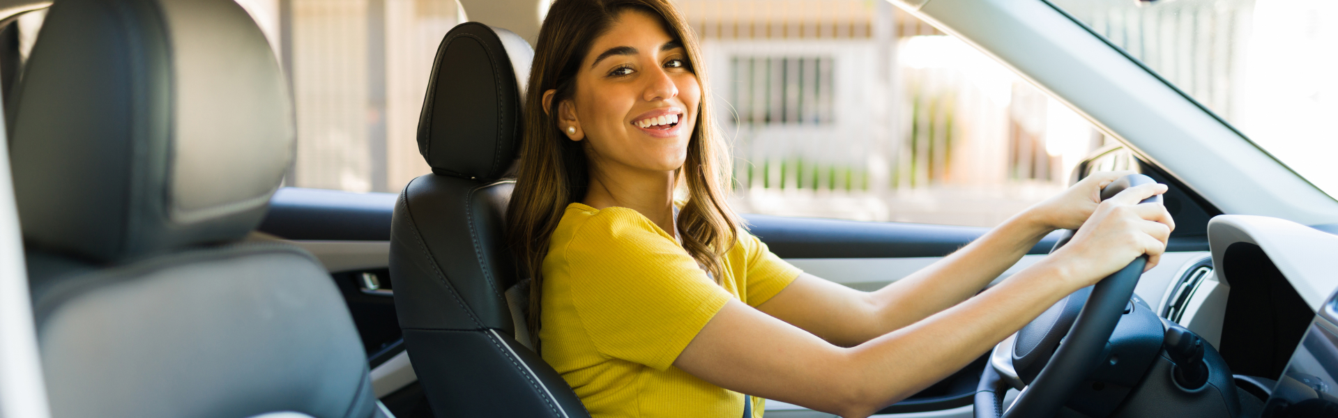 Yes Automotive Customer driving off happily in her first car